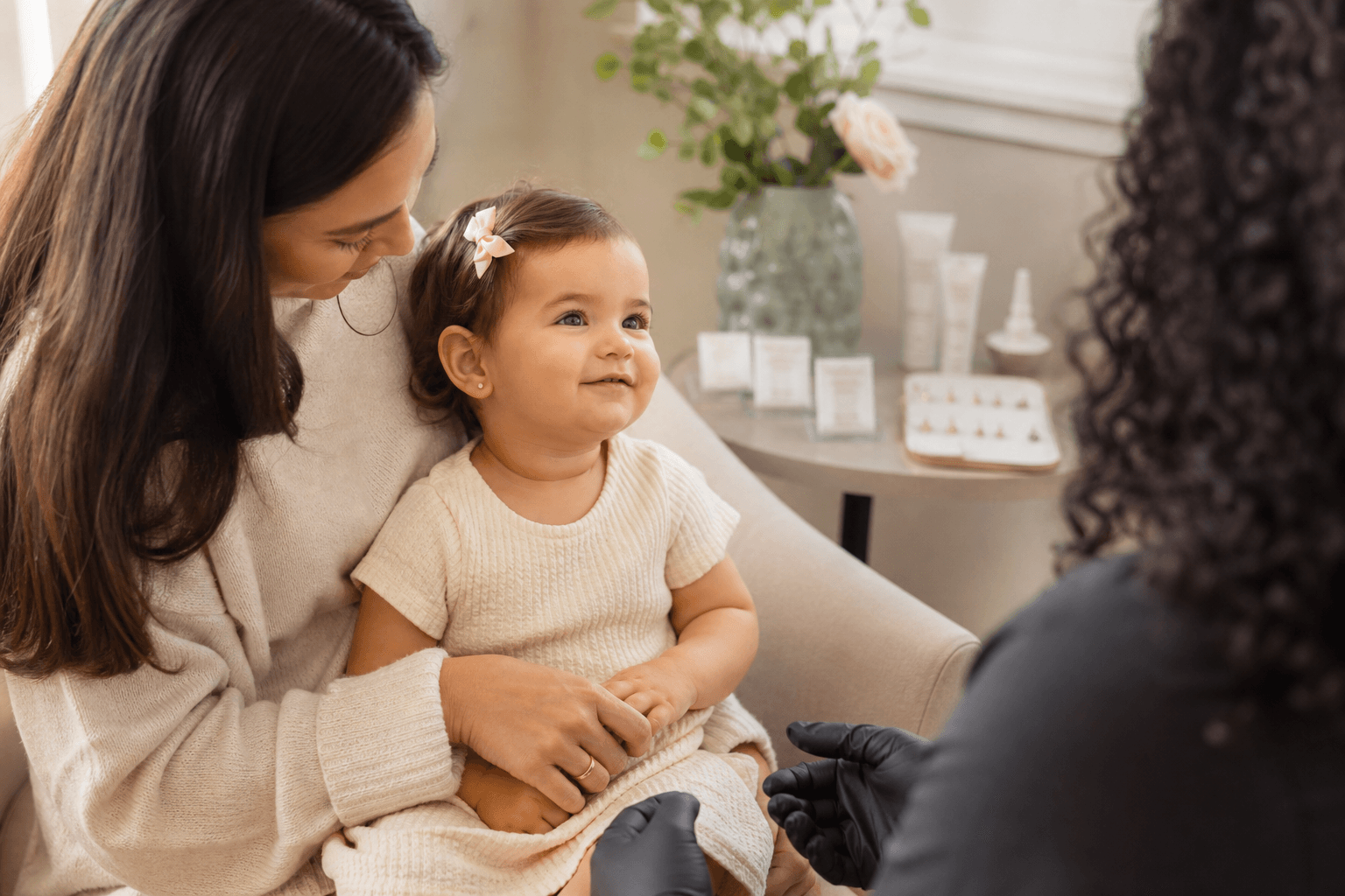 Calm pediatric consultation for baby ear piercing with Jenny Coleman, CPNP at Williamsburg Med Spa